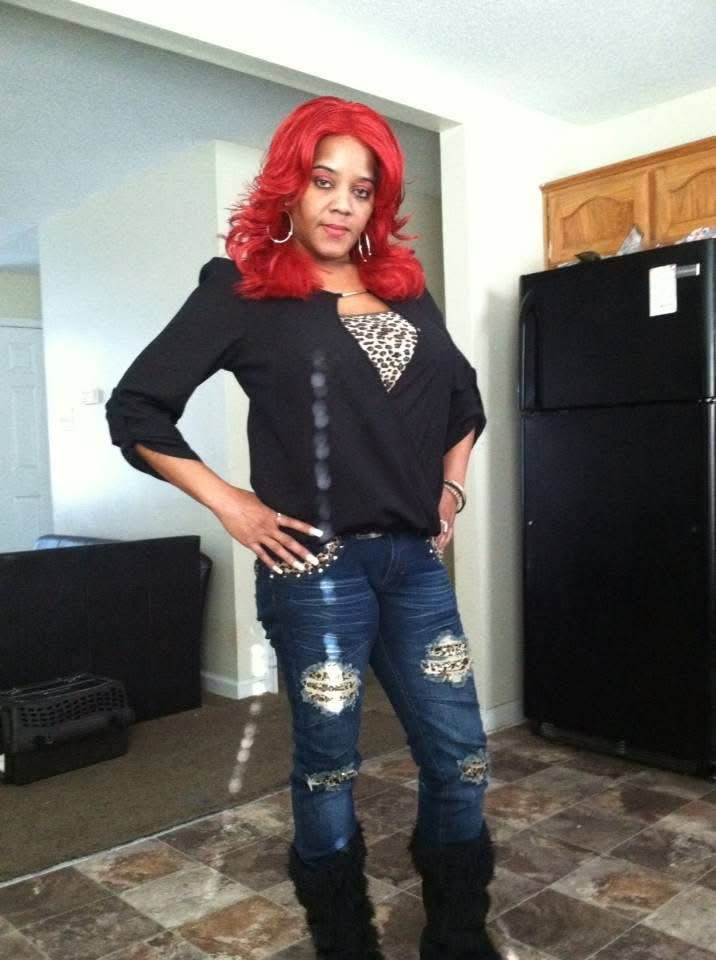Lisa Ann Woods standing in her home.